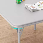 Ensemble table et deux chaises pliantes pour enfants, avec coussins en PU, facile à ranger, idéal pour les repas, la lecture et les jeux des enfants.