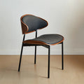Chaise de salle à manger à dossier incurvé en cuir noir